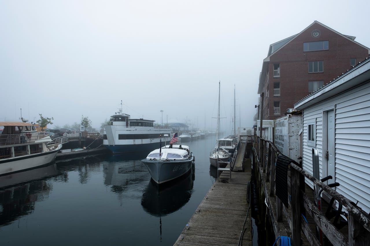 A foggy morning view of boats docked in Portland Harbor, Maine, USA.